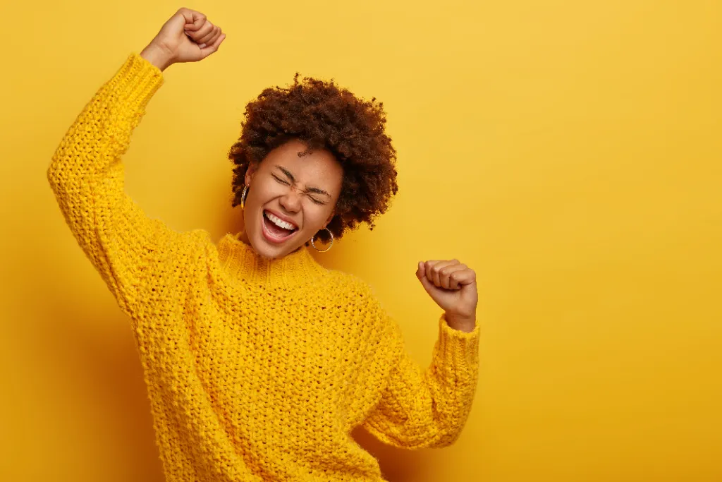 curly-haired-girl-in-winter-yellow-sweater-dances-2026-01-11-08-36-14-utc