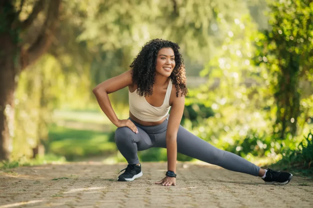woman stretching in a park on sunny morning before 2026 01 08 23 12 24 utc